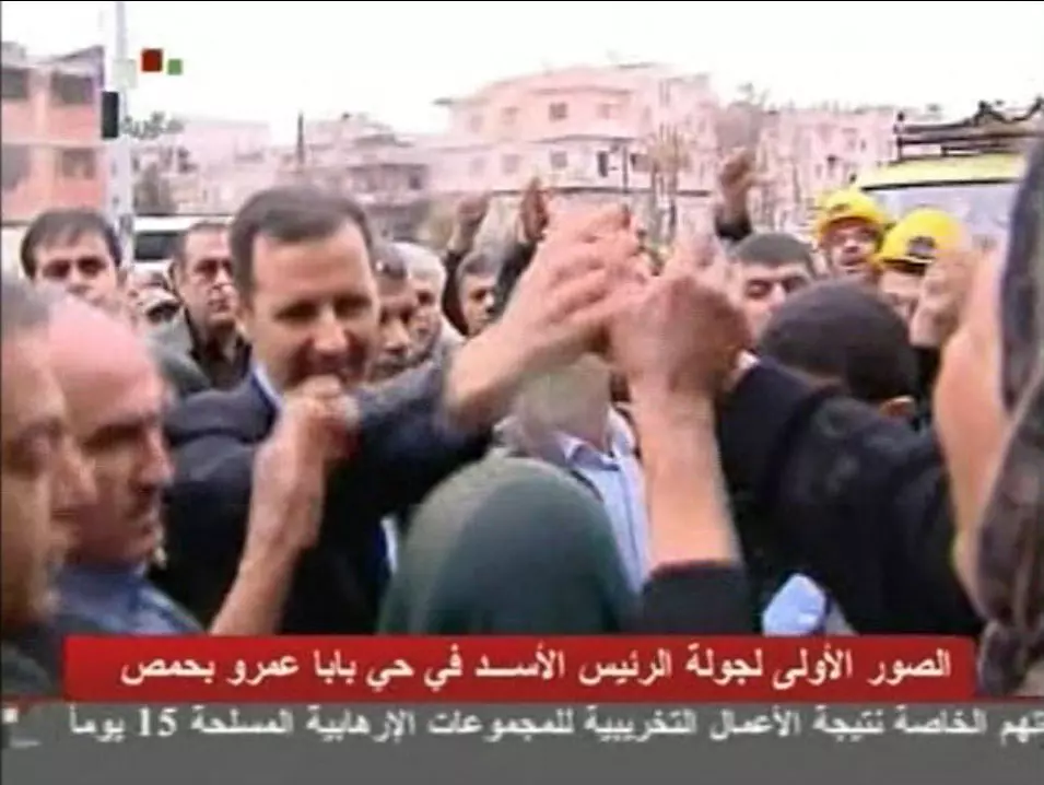 ניצל. אסד ותושבים, היום בבאבא עמר, מתוך שידורי הטלוויזיה הסורית