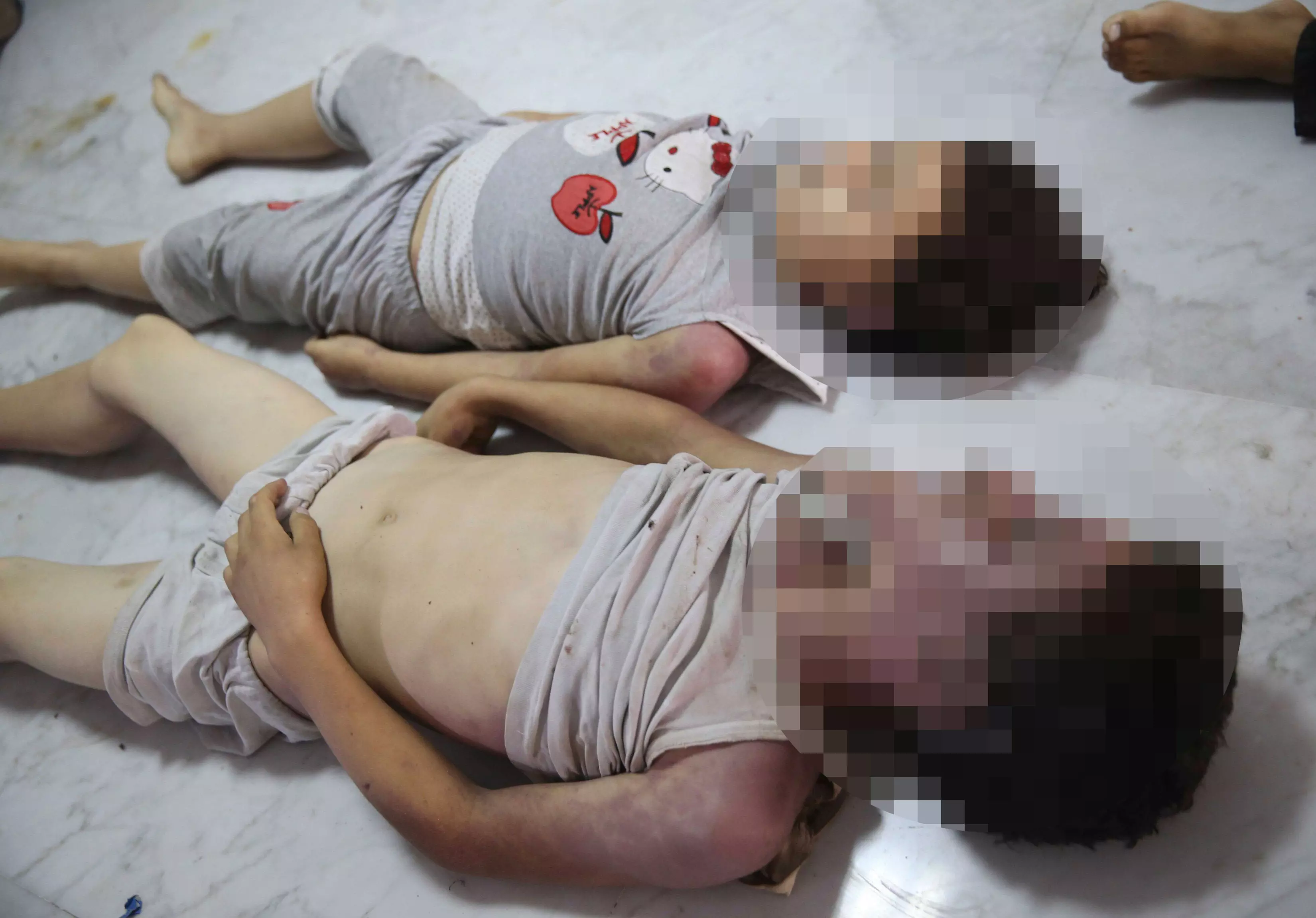 אסון הומניטרי ברור. גופות ילדים שנפגעו מנשק כימי, בחודש שעבר בפרברי דמשק