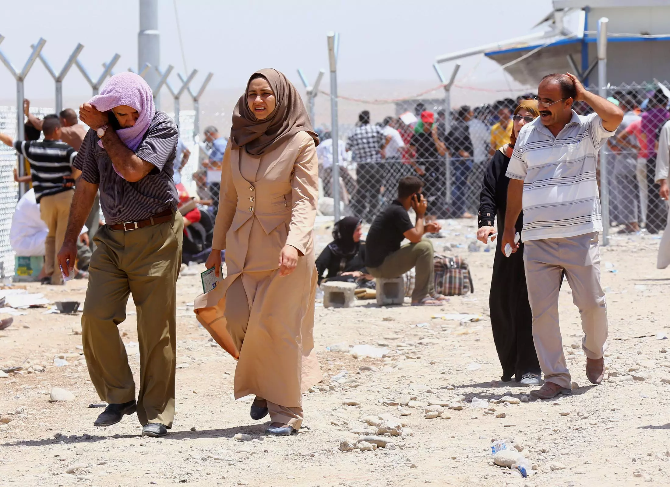 אזרחים ממוסול נמלטים בעקבות הפחד מאנשי "המדינה האיסלאמית" בחודש יוני