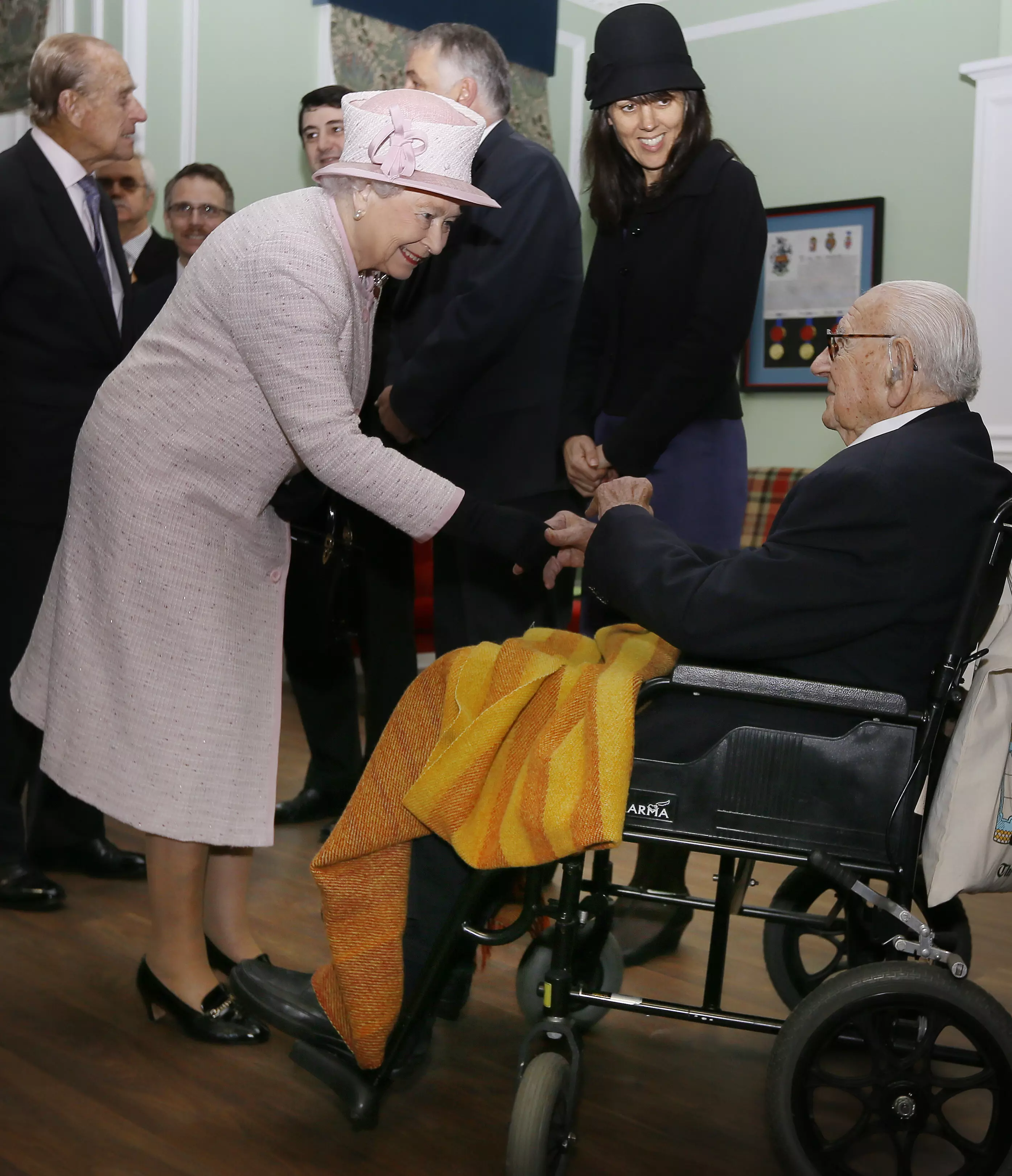וינטון עם המלכה אליזבת ב-2014