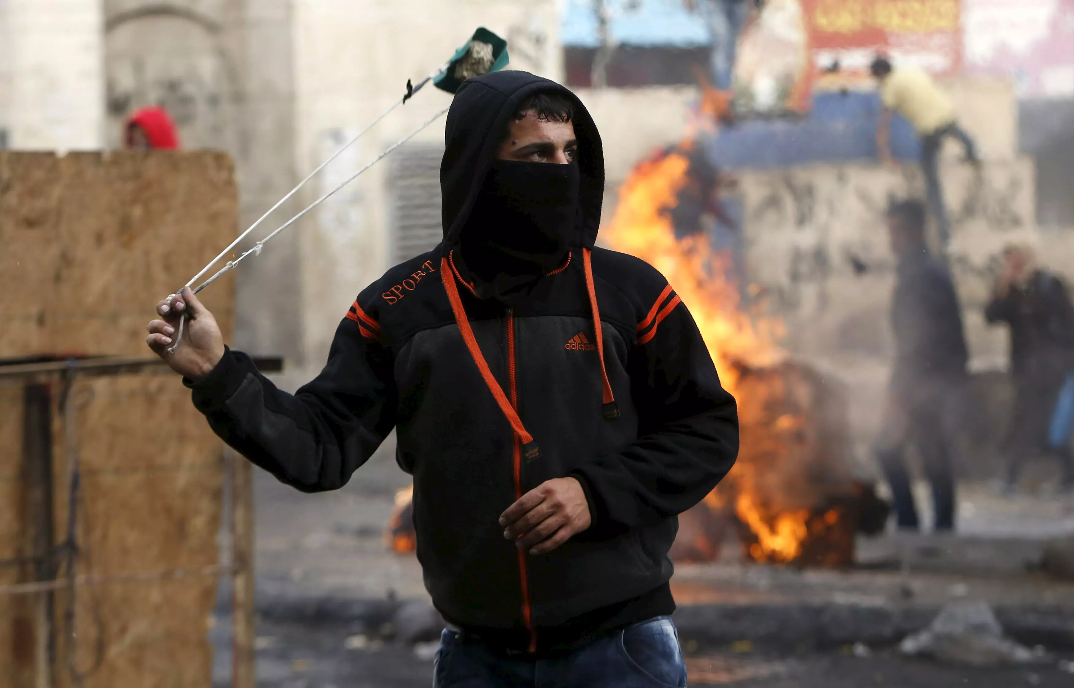 פלסטיני בעת עימותים בחברון, השבוע