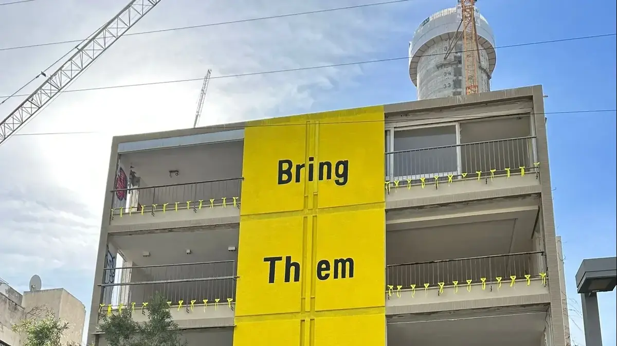 In the call for the return of the hostages the façade of the building