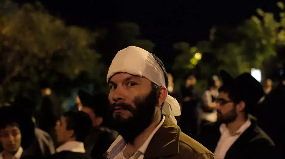 מפגין שנפצע בהפגנת חרדים נגד הגיוס לצה"ל בירושלים, 16 במאי 2013