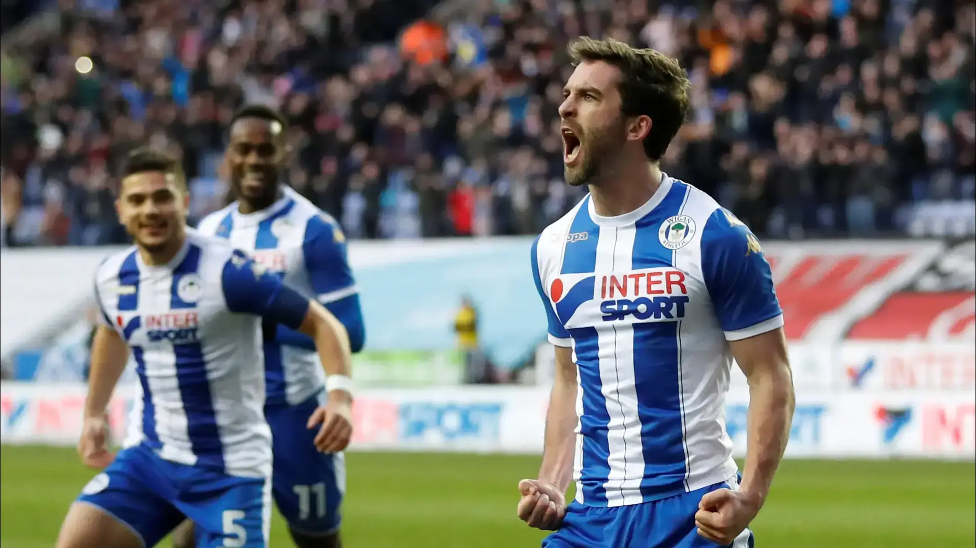 וויל גריג שחקן וויגאן חוגג שער וויל גריג שחקן וויגאן חוגג שער