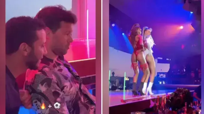 מיכאל באלאק צופה במשחק של צ'לסי על רקע שתי רקדניות במועדון לילה מיכאל באלאק צופה במשחק של צ'לסי על רקע שתי רקדניות במועדון לילה