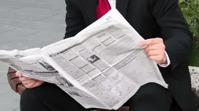 אילוסטרציה איש קורא עיתון