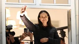 Nobel Peace Prize laureate Maria Corina Machado waves from a balcony of Grand Hotel, after her daughter Ana Corina Sosa Machado, accepted the award on her behalf, in Oslo, Norway December 11, 2025.