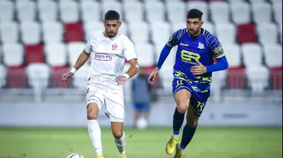 שחקן בני סכנין איהאב גנאים לצד שחקן מכבי בני ריינה אוסמה חלאיילה. מאור אלקסלסי