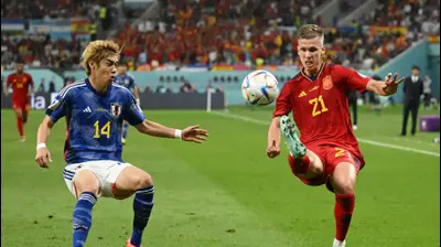 שחקן נבחרת ספרד דני אולמו נגד שחקן נבחרת יפן ג'וניה איטו. Clive Mason,GettyImages