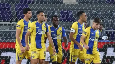 שחקני מכבי תל אביב חוגגים. דני מרון