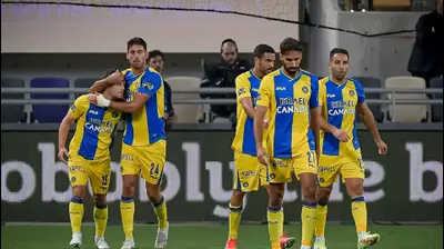 שחקני מכבי תל אביב חוגגים. אריאל שלום