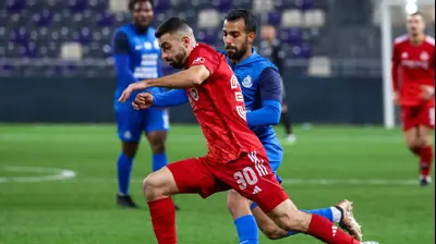 שחקן הפועל תל אביב הישאם לאיוס, מול שחקן מ.ס. אשדוד הישאם לאיוס. דני מרון