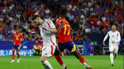 ניקו וויליאמס נבחרת ספרד לצד ז'ורז'יניו נבחרת איטליה. רויטרס