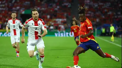 אוטאר קקבאדזה נבחרת גאורגיה לצד ניקו וויליאמס נבחרת ספרד. רויטרס