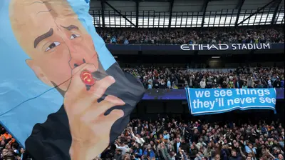 כרזת תמיכה של אוהדי מנצ'סטר סיטי במאמנם פפ גווארדיולה. Carl Recine,GettyImages