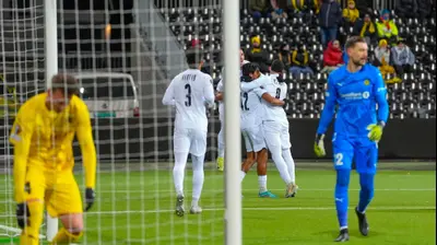 שחקני מכבי תל אביב חוגגים. LISE ASERUD/AFP,GettyImages