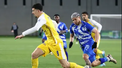 דור תורג'מן שחקן מכבי תל אביב לצד כריסטיאן מרטינס שחקן עירוני קרית שמונה. דני מרון