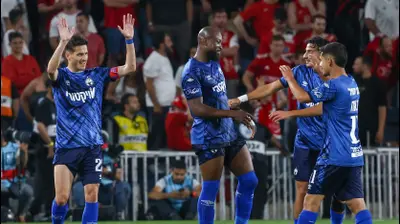 שחקני הפועל באר שבע חוגגים עם ארנולד גאריטה. דני מרון