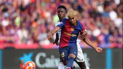 לאמין ימאל שחקן ברצלונה לפני ויניסיוס שחקן ריאל מדריד. רויטרס