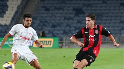 אוהד אלמגור, הפועל ירושלים לצד גיא מזרחי, הפועל באר שבע. ברני ארדוב