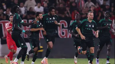 שחקני מכבי חיפה חוגגים עם טריבנטה סטיוארט. מאור אלקסלסי