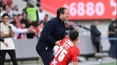 רוני לוי מאמן מכבי נתניה עם לויזוס לויזו שחקן הפועל תל אביב. ברני ארדוב